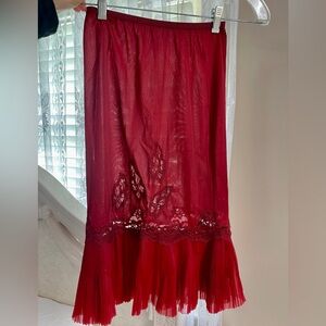 Vintage slip. Deep red size small. Has a little see through areas